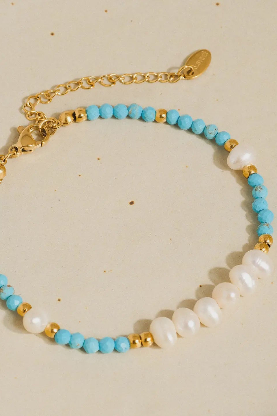 turquoise, gold, and pearl beaded bracelet with clasp