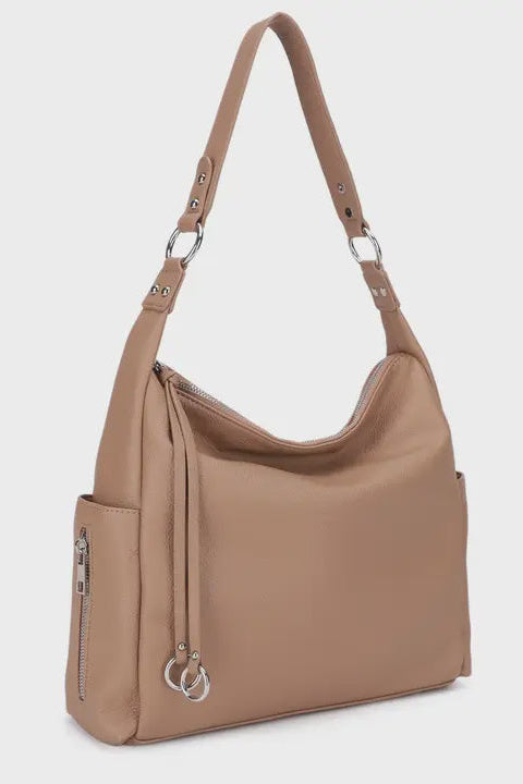 Beige handbag with a shoulder strap on a white background