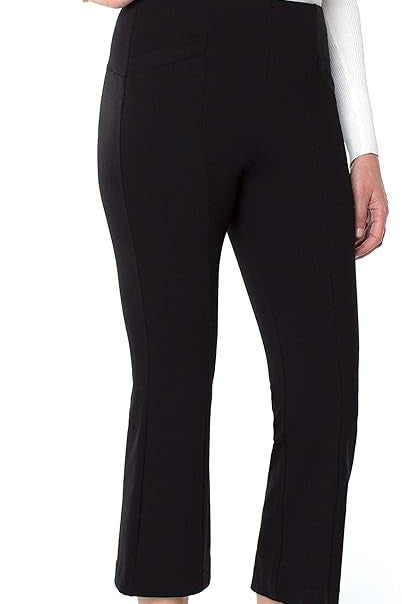 Black capri pants worn by a person on a white background