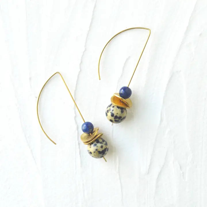 Pair of earrings with blue and gold beads on a white background
