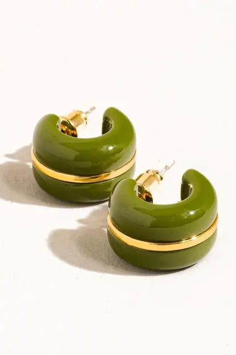 Green hoop earrings with gold accents on a white background