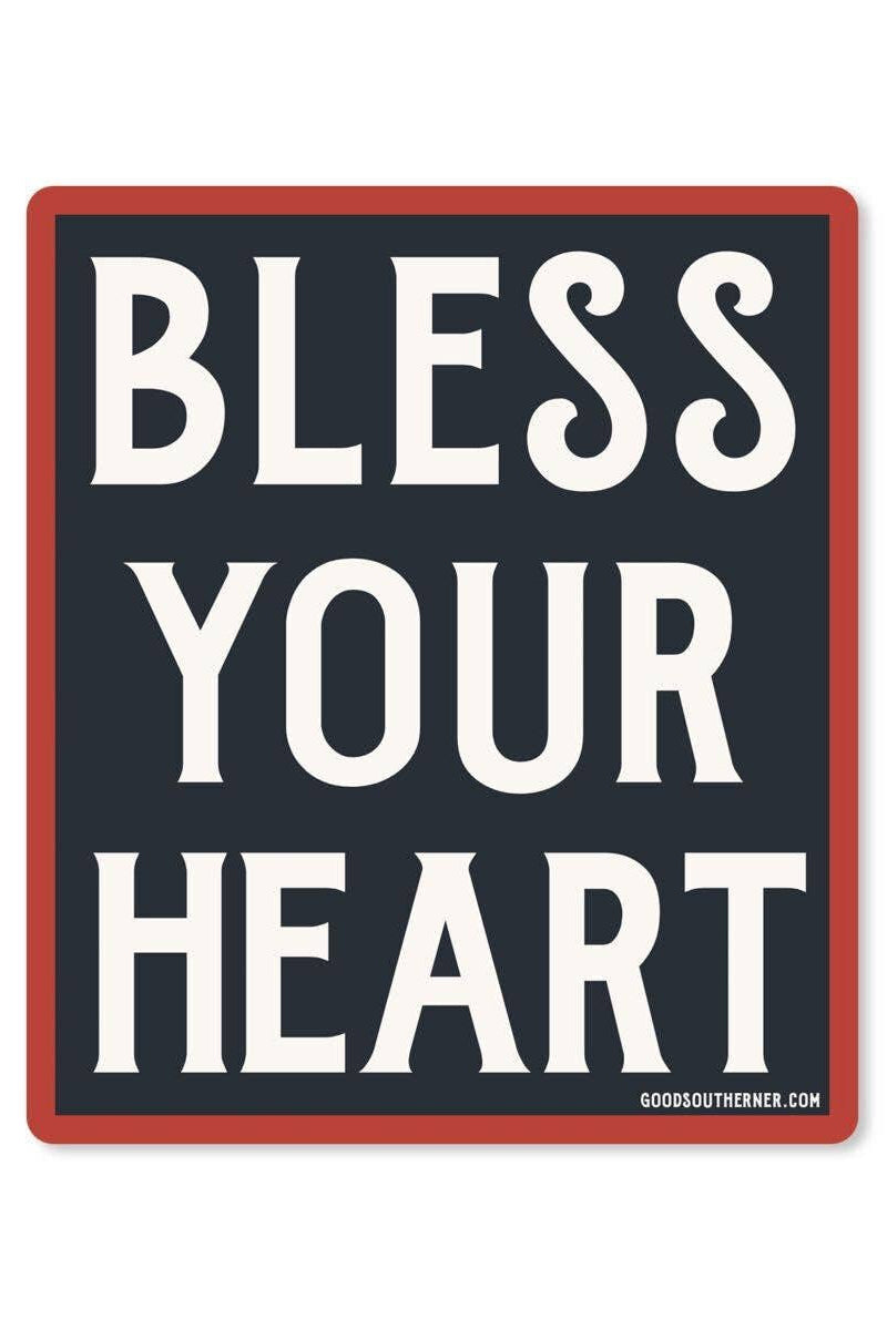 A square sign with the words 'BLESS YOUR HEART' in large white serif letters on a dark charcoal background, with a red border and a small 'GOODSOUTHNER.COM' print at the bottom right.