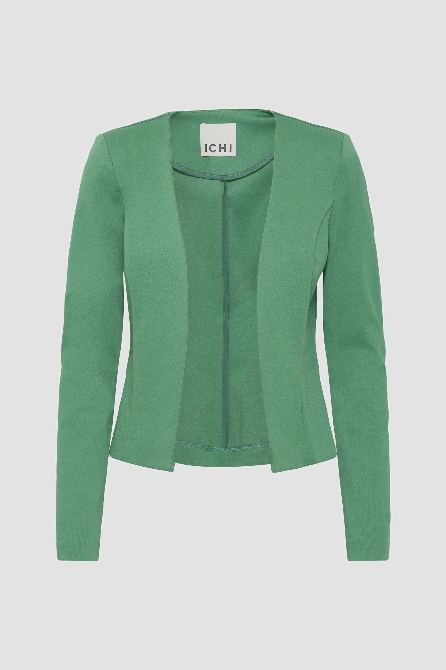 Green cardigan on a light gray background