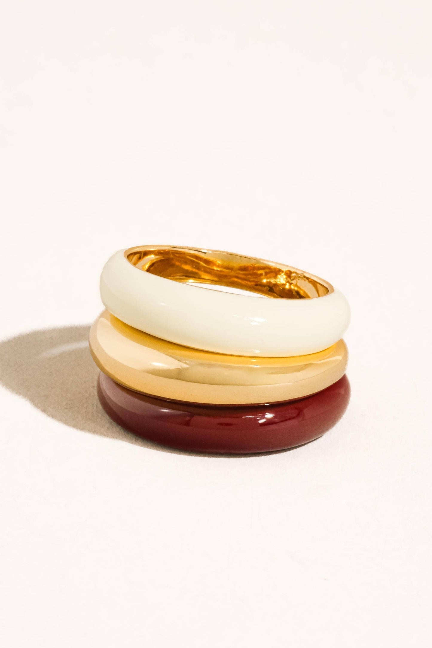 Stack of three colorful rings on a white background