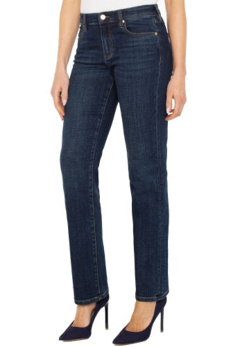 Person wearing dark blue jeans on a white background