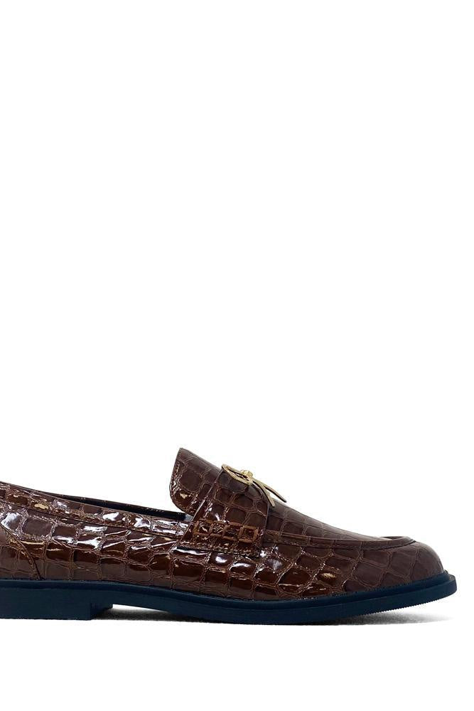 Brown crocodile-patterned loafer shoe on a white background