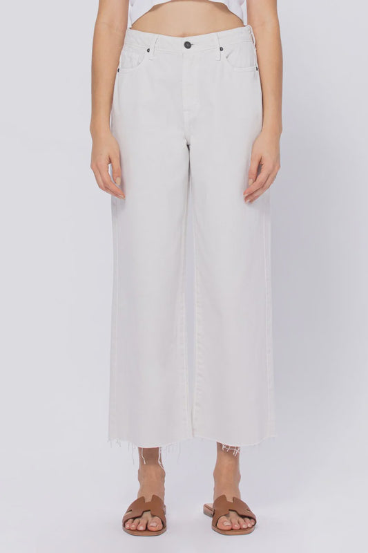 Person wearing light-colored pants on a white background