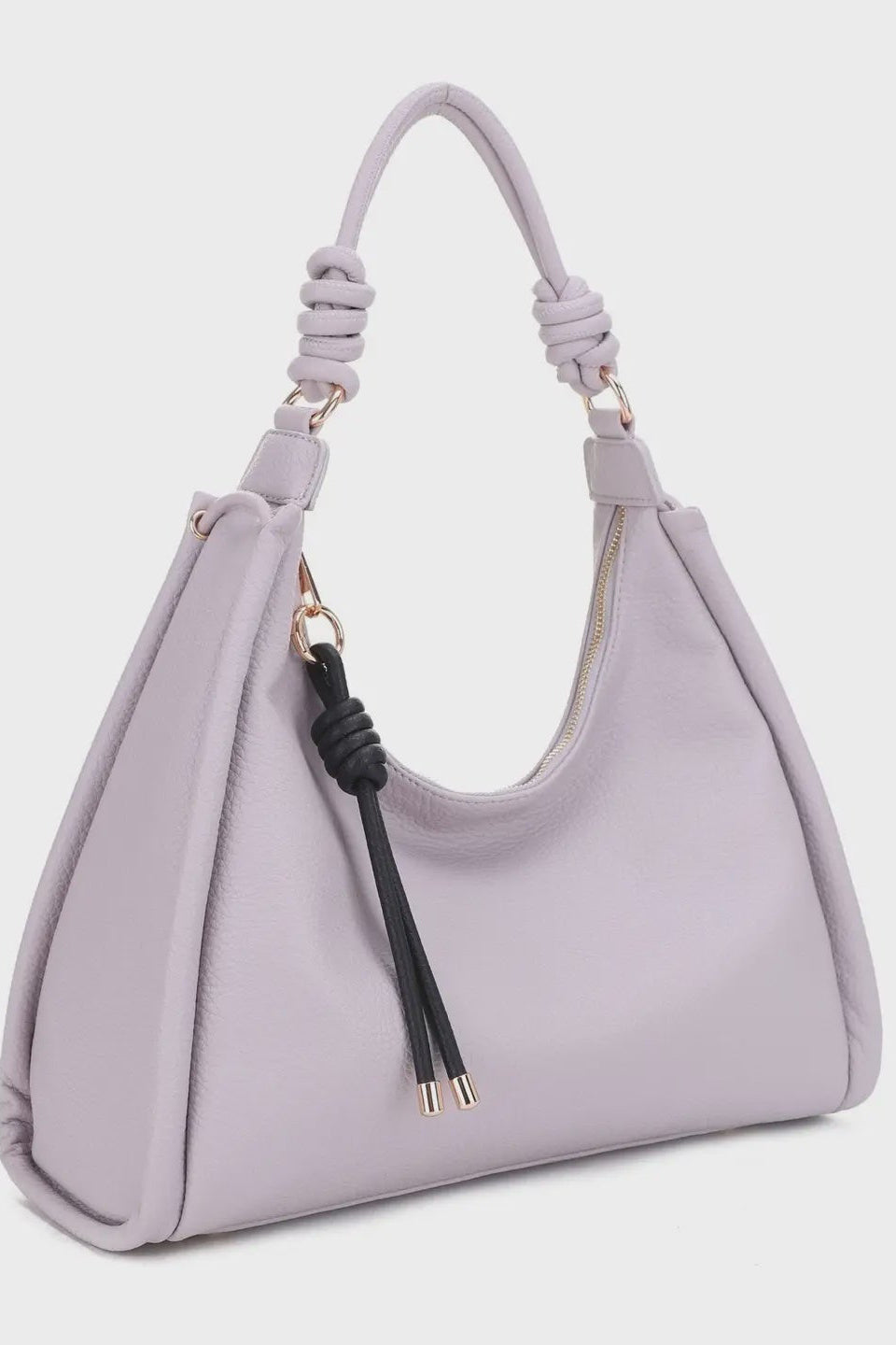 Lavender handbag with a decorative strap on a light gray background