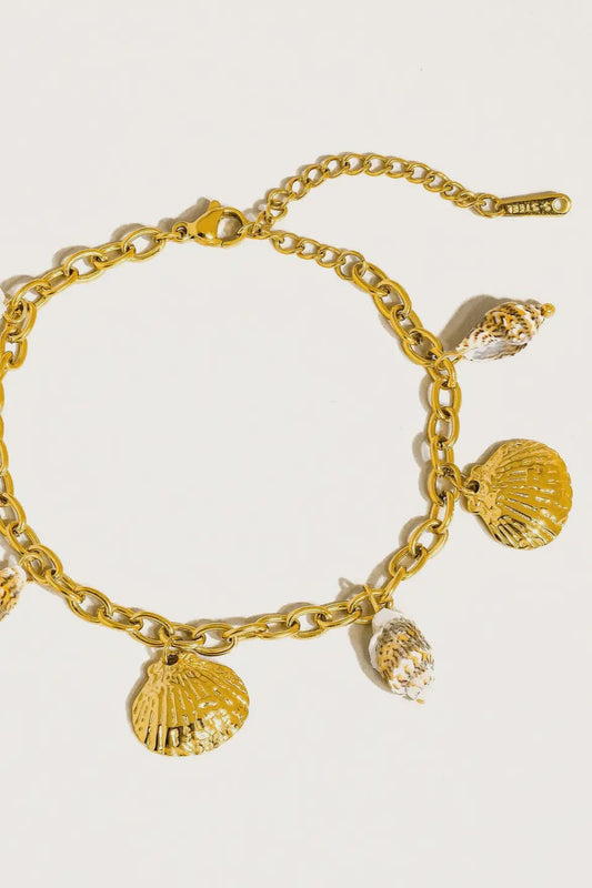 gold plated mixed seashell charm bracelet with a clasp 