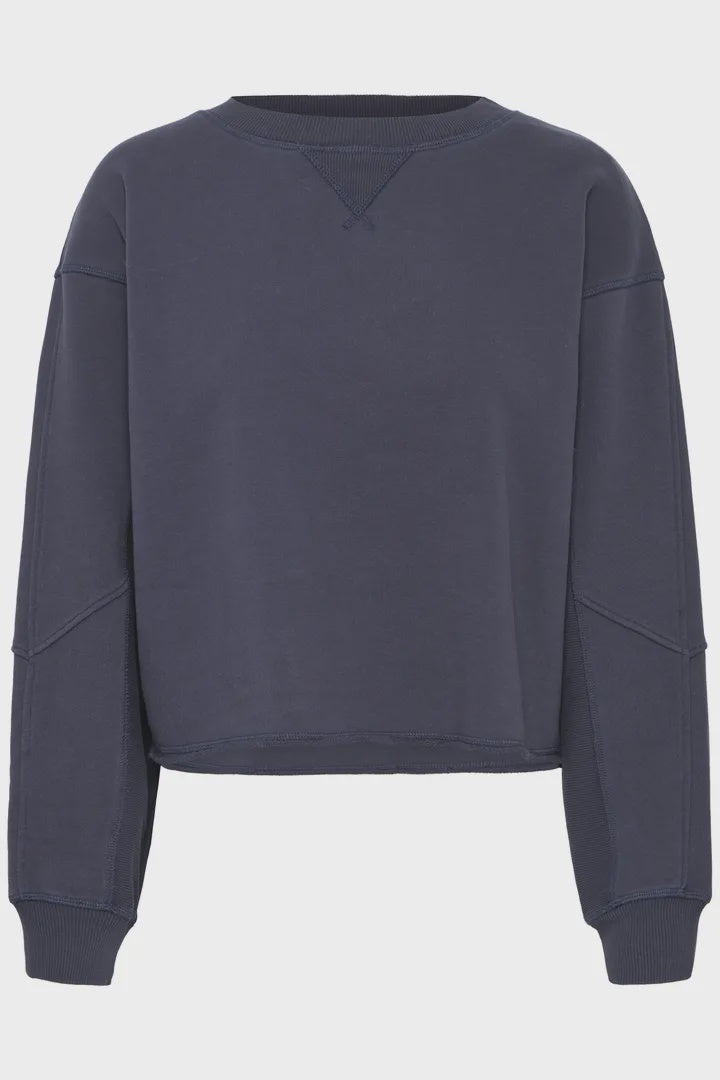 Navy blue sweatshirt on a light gray background