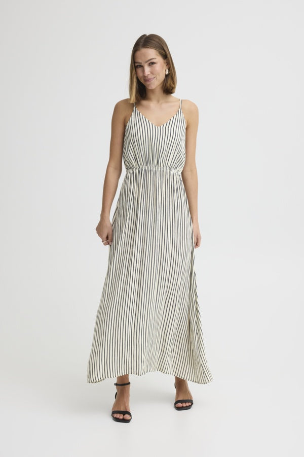 Woman wearing a striped dress on a white background