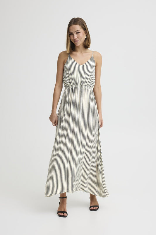 Woman wearing a striped dress on a white background