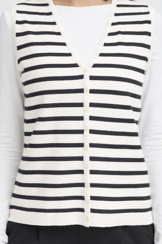 Black and white striped vest over a white shirt