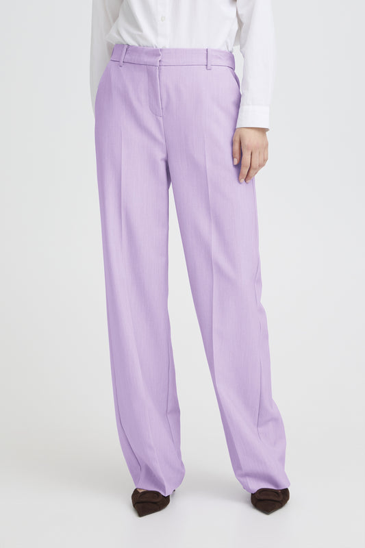 Person wearing lavender pants on a white background
