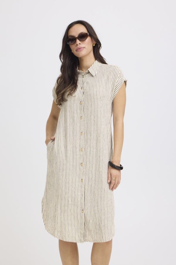Woman wearing a sleeveless striped dress on a white background