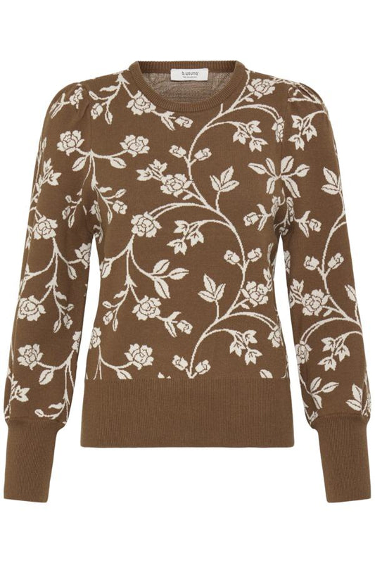 A brown crewneck sweater featuring an intricate white floral and vine knit pattern, displayed against a solid white background.