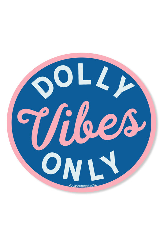 A circular sticker or decal with the words 'DOLLY Vibes ONLY' in white and pink lettering on a blue background, with a thin pink outer border, shown on a plain white background.
