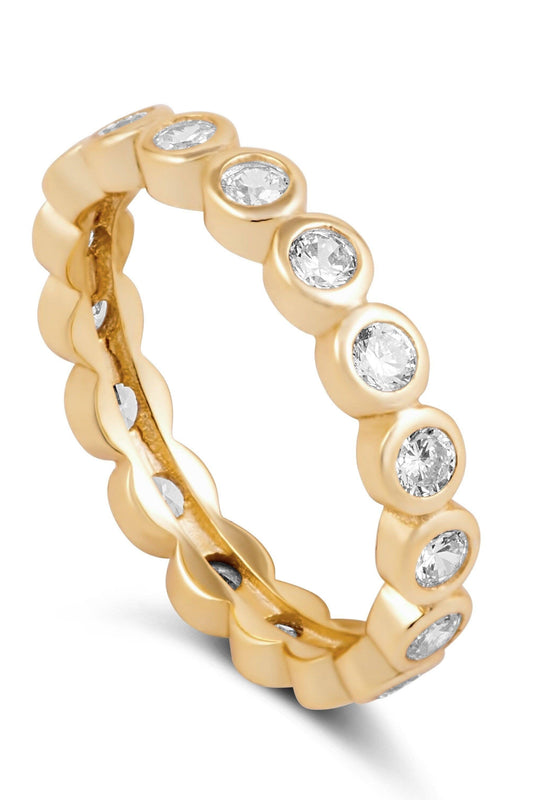 Gold ring with embedded diamonds on a white background