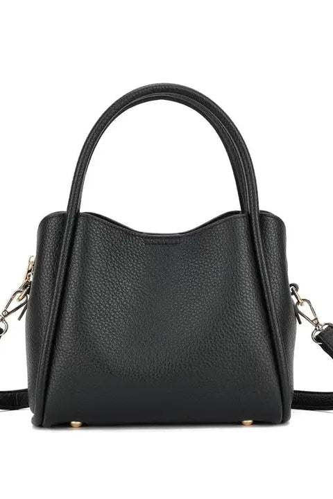 Black handbag with a strap on a white background