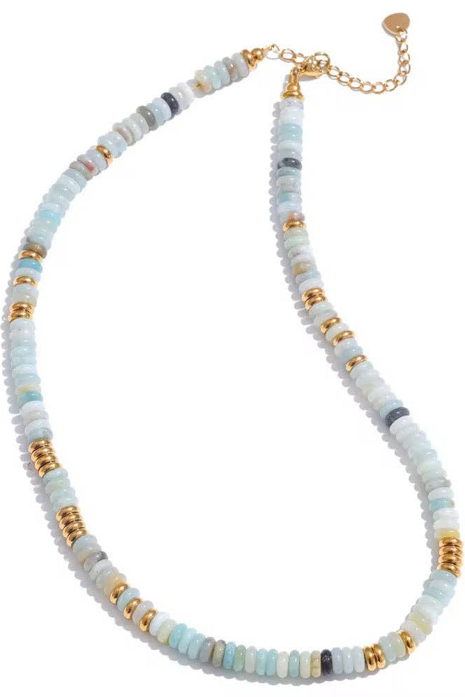 Necklace with multicolored beads and gold accents on a white background