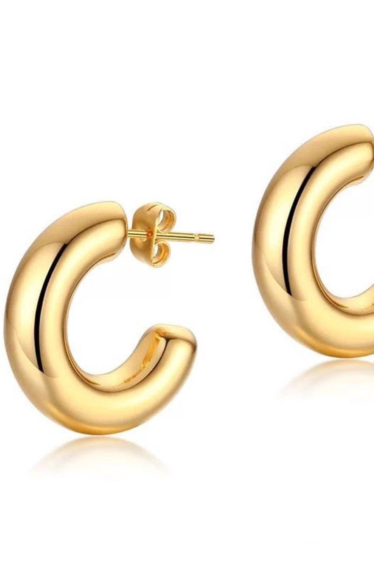 Gold hoop earrings on a white background