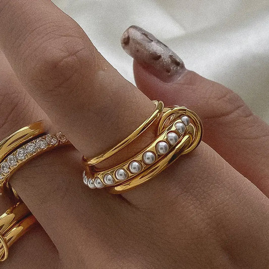 gold 3 ring stack  with 1 pearl inlaid band 