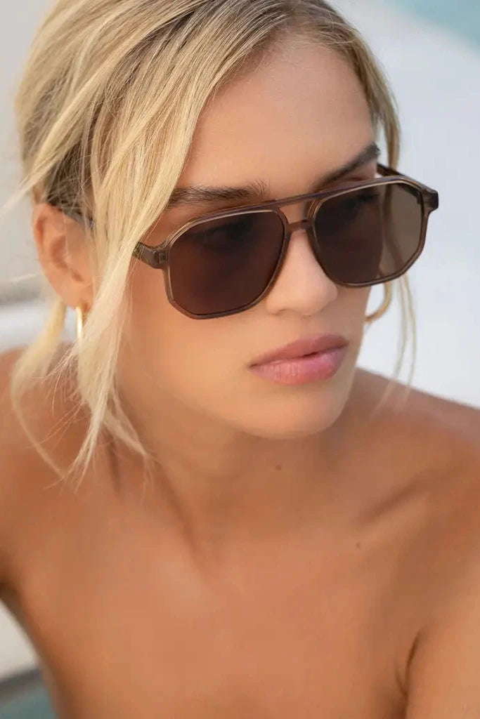 Woman wearing sunglasses with a blurred background