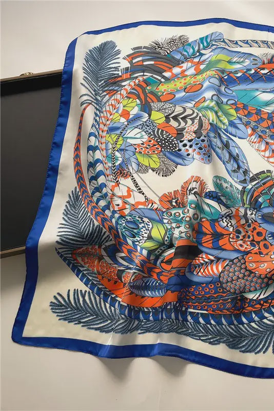 Colorful scarf with fish and leaf pattern on a white background