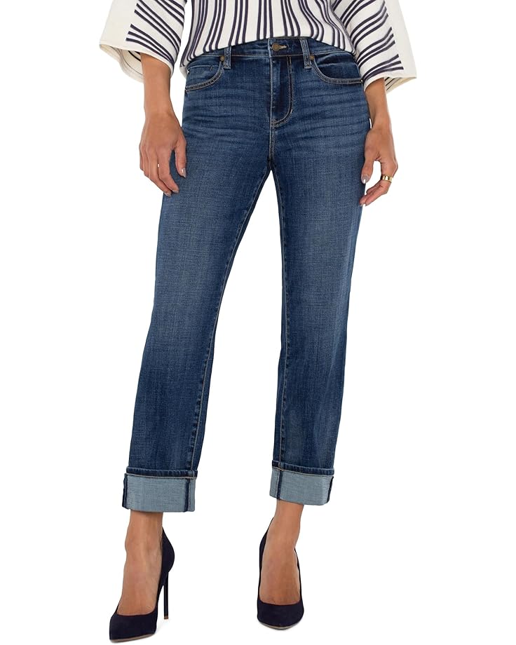 Blue jeans worn by a person on a white background