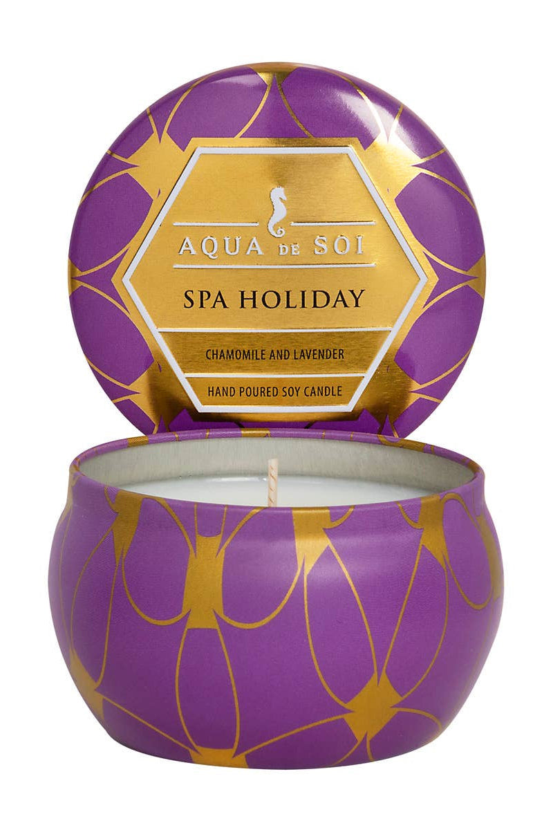 Purple and gold candle with 'Aqua de Soi' branding on a white background