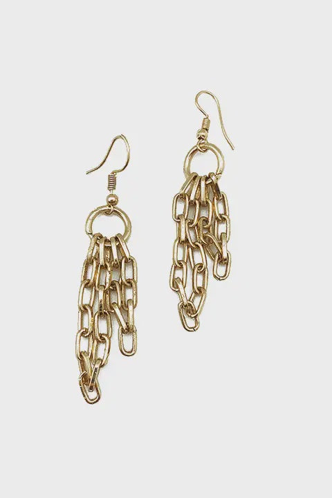 Gold chain earrings on a light gray background