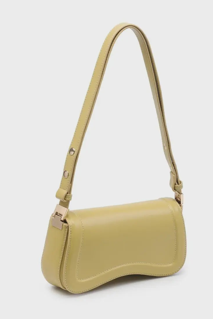 Yellow handbag with a strap on a white background