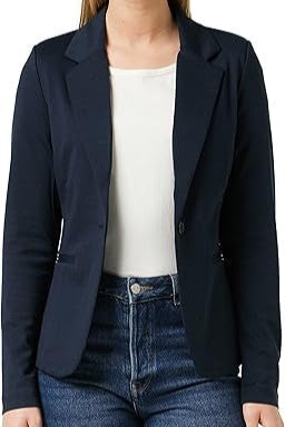 Person wearing a navy blazer over a white shirt and blue jeans on a white background