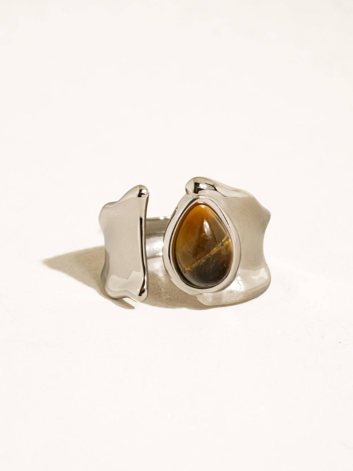 Silver ring with a clasp on a white background