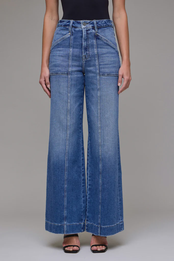 Wide-leg jeans worn by a person on a neutral background