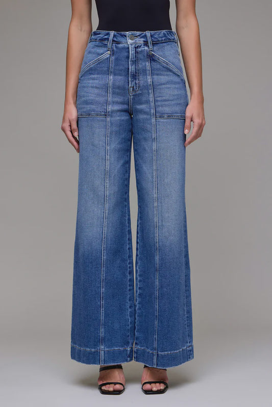 Wide-leg jeans worn by a person on a neutral background