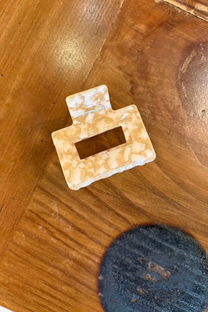 Decorative brooch on a wooden surface