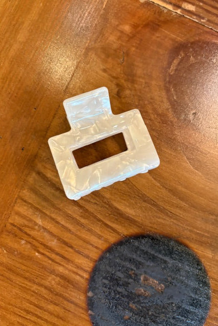 White rectangular object on a wooden surface