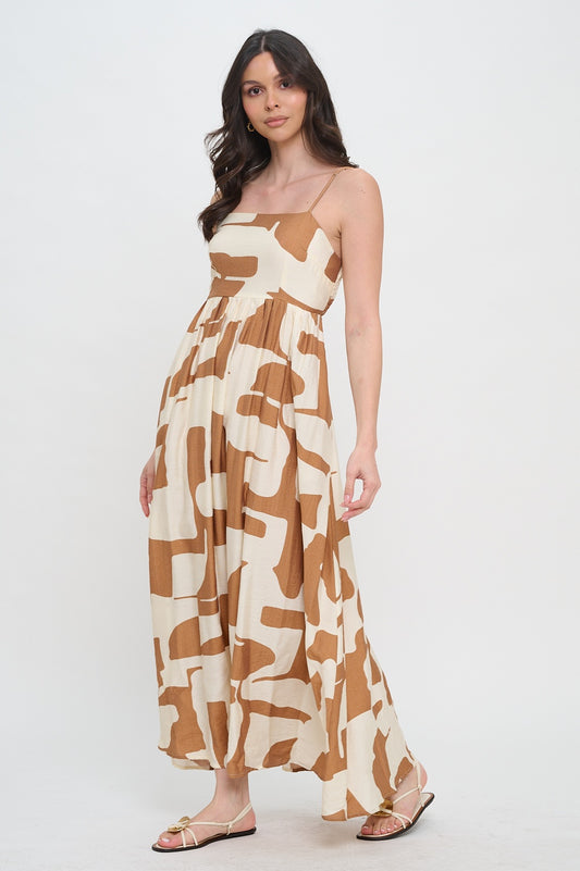 Woman wearing a brown and beige patterned dress on a white background