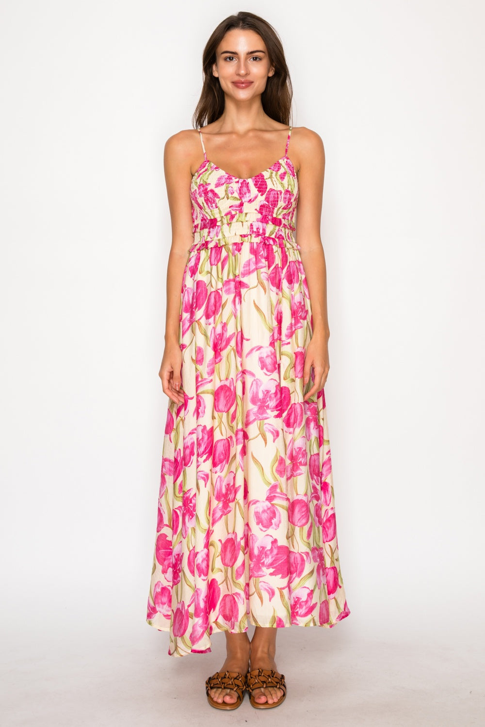 Woman wearing a floral dress on a white background