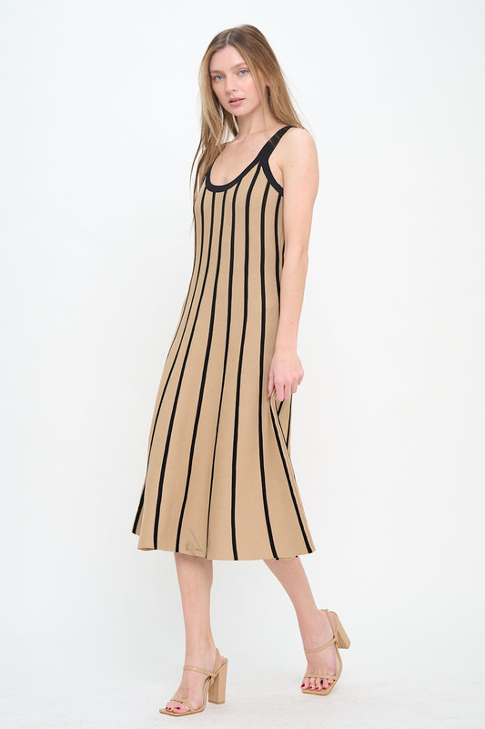 Woman wearing a beige and black striped dress on a white background