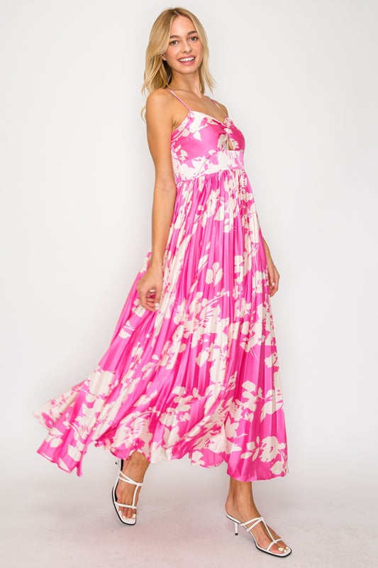 Woman wearing a pink floral dress on a white background