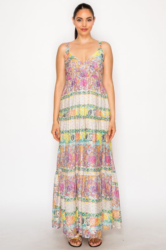 Woman wearing a colorful floral dress on a white background