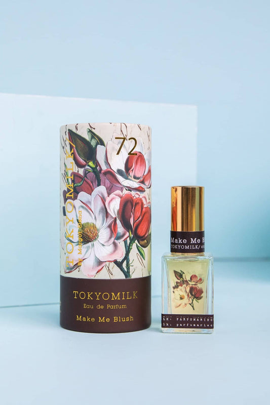 TOKYOMILK perfume bottle and packaging on a light blue background