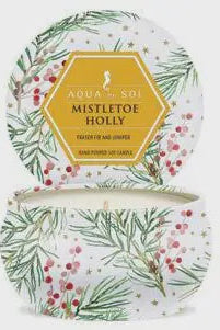 Decorative candle in a tin with mistletoe and holly design, featuring the brand 'Aqua & Co'.