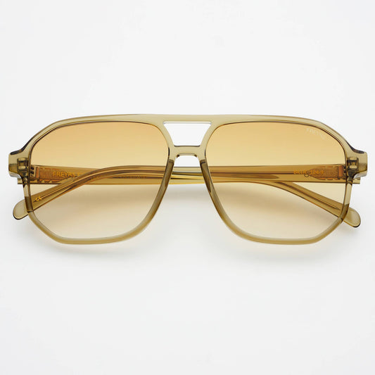 Gold-framed sunglasses with yellow-tinted lenses on a white background