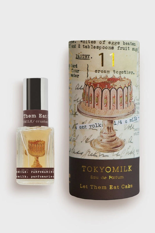 TOKYOMILK perfume bottle and packaging with cake design on a white background