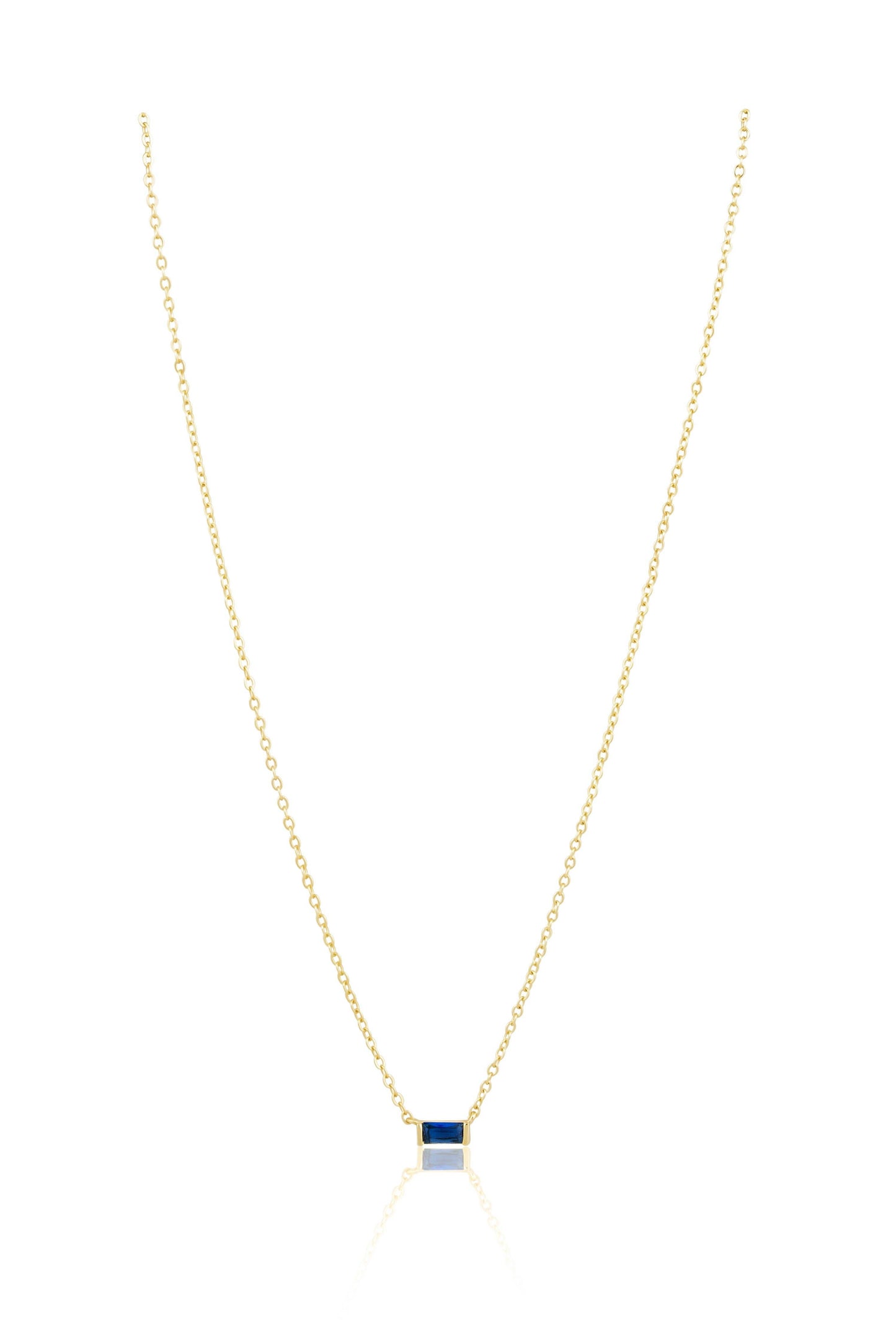 Gold necklace with a square pendant on a white background