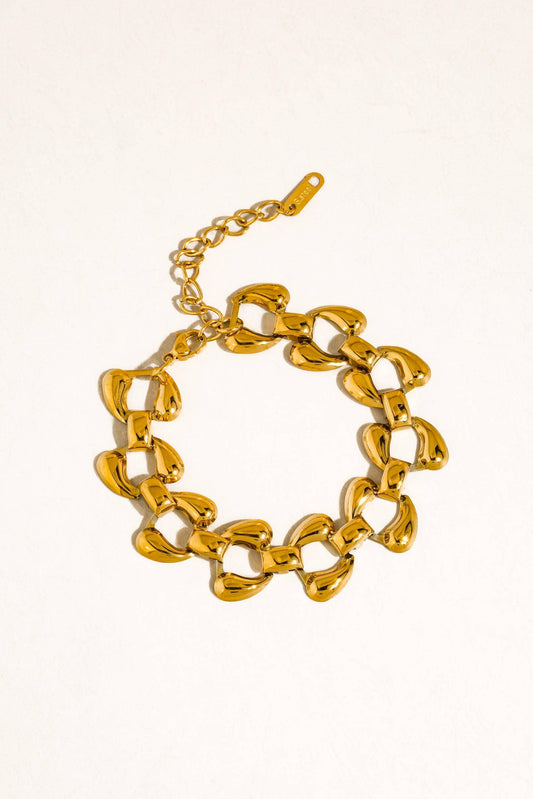 Gold chain bracelet on a white background