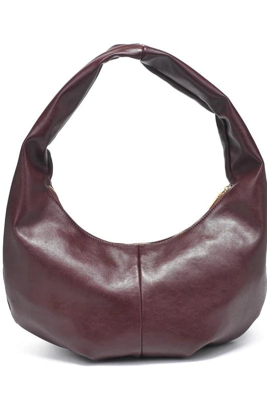 Burgundy handbag on a white background
